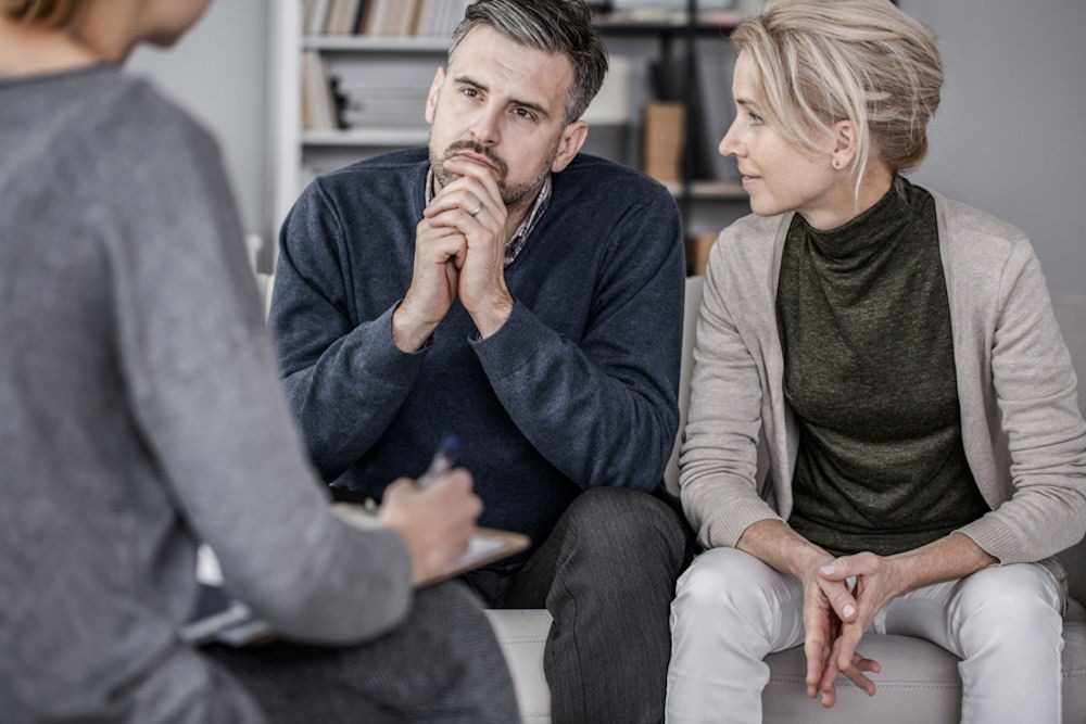 Heterosexual couple discussing opioid addiction in couples counseling