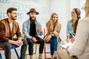 Group of hipsters talking about intolerance to alcohol in a group setting