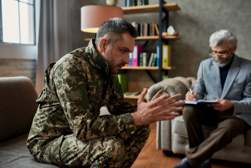 Man wearing camouflage army fatigues discussing functional alcoholism