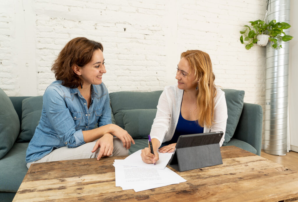 Woman consulting with doctor on a couch about alcohol and UTIs